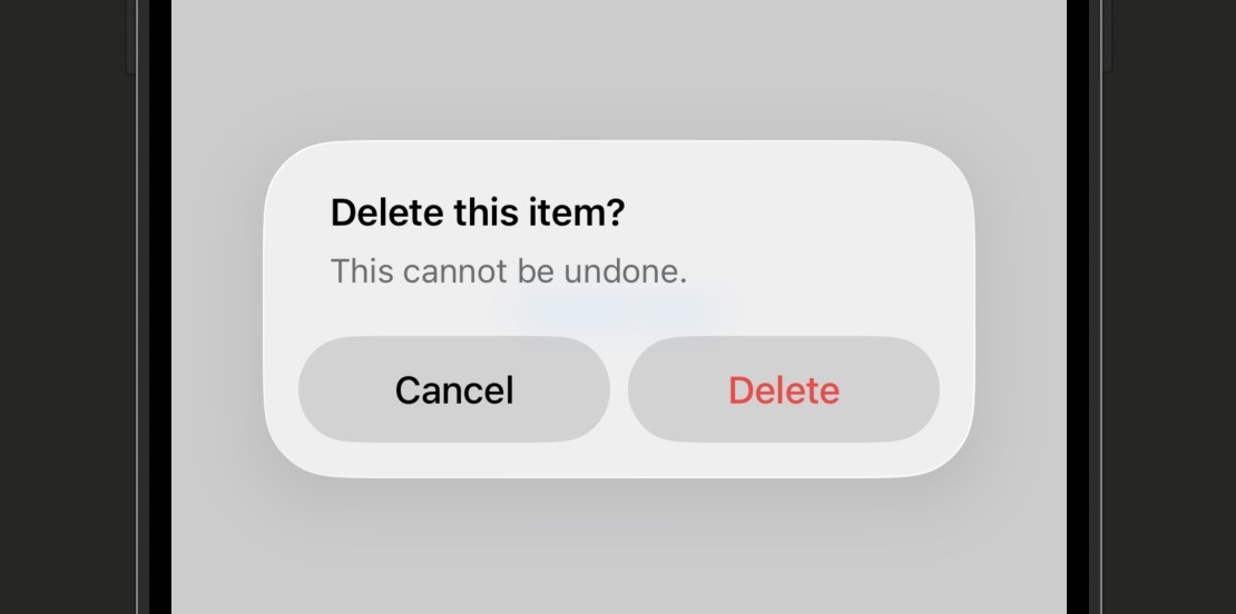Simulator screenshot showing a 'Delete this item?' alert centered on the screen with the message 'This cannot be undone.' and two buttons: a red 'Delete' and a 'Cancel'